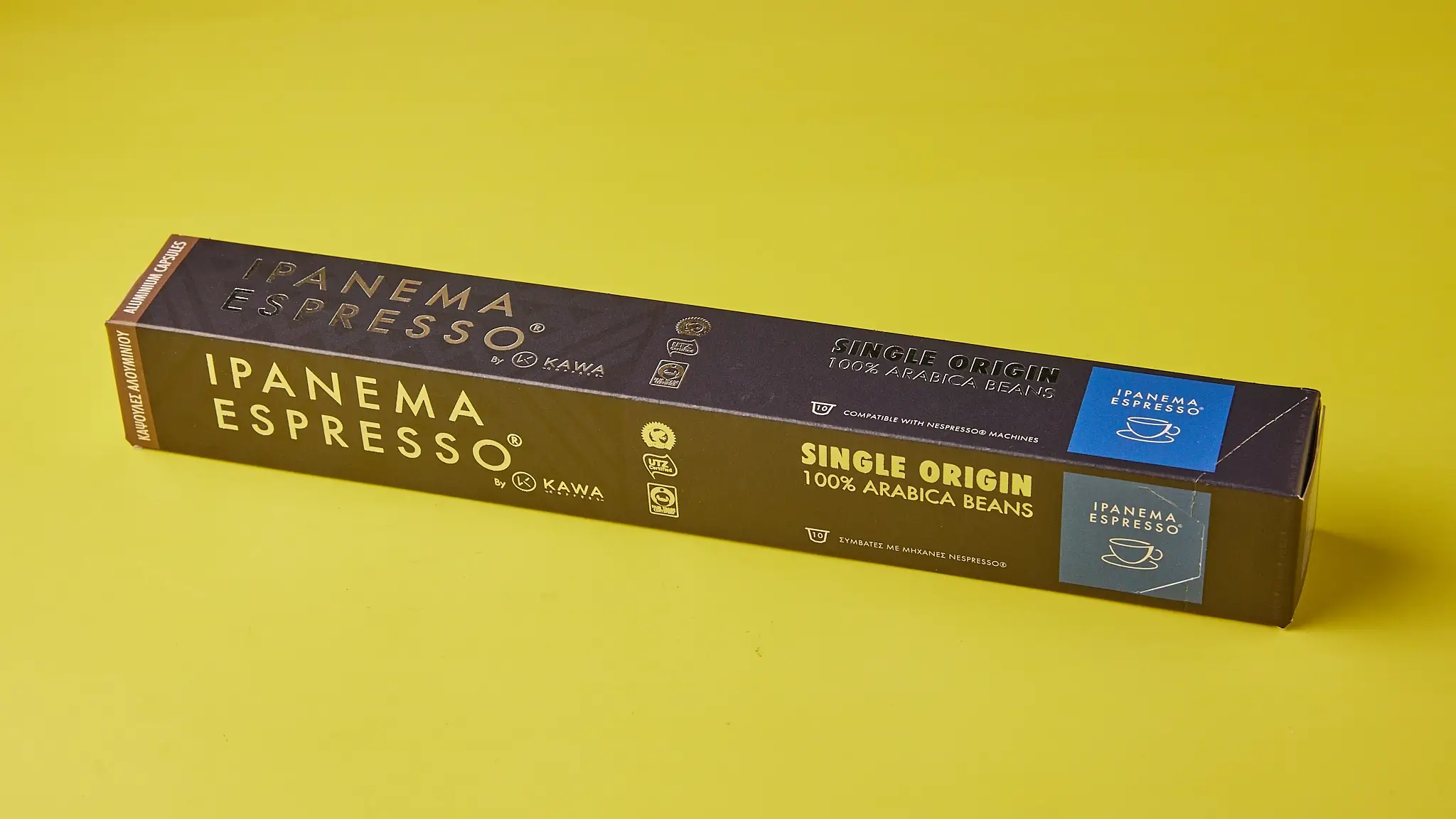 Συσκευασία καφέ Ipanema Espresso Single Origin 100% Arabica σε κίτρινο φόντο.